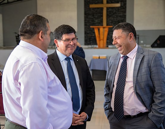 Church leaders talking and laughing together