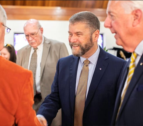 Business man shaking someones hand