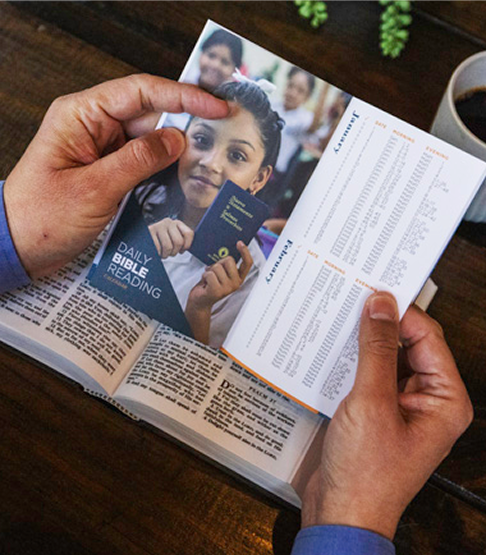 Man looking at a flyer about gideons